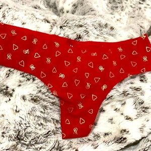 Bright red No show thong with golden details.